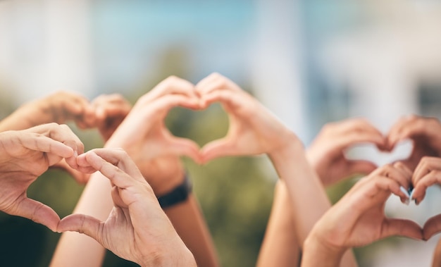 Crowd hands and heart sign with group of people community and friends with emoji for care freedom and health outdoor Fans concert and support of men and women on solidarity for charity thank you