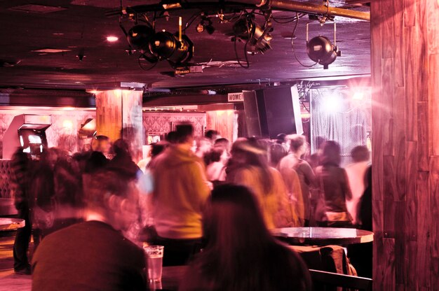 Crowd in illuminated room