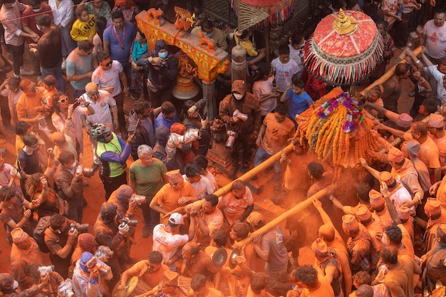 A crowd of people are gathered around a holi festival.