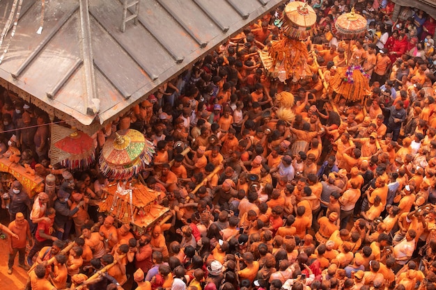 A crowd of people are gathered in a festival