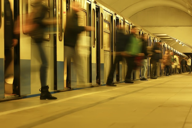 crowd of people metro in motion blurred, abstract background urban traffic people