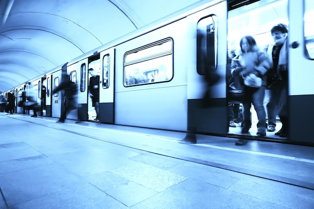 crowd of people metro in motion blurred, abstract background urban traffic people