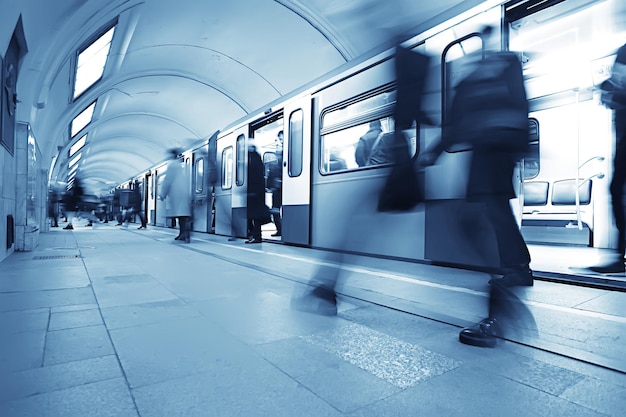 crowd of people metro in motion blurred, abstract background urban traffic people