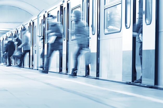 crowd of people metro in motion blurred, abstract background urban traffic people