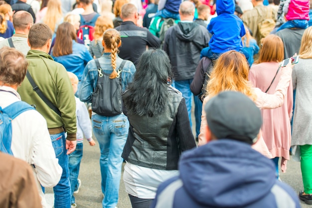 Crowd of people walking on the city street