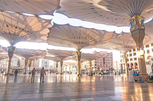 Crowd below sunshades of al-masjid an-nabawi