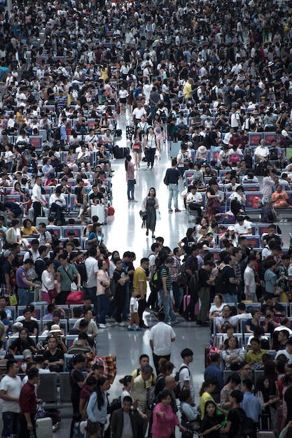 crowd waiting at railroad station