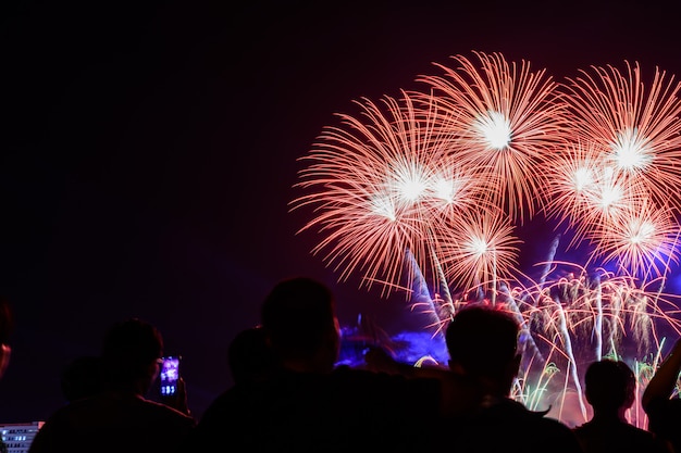 Crowd watching fireworks and celebrating city founded.