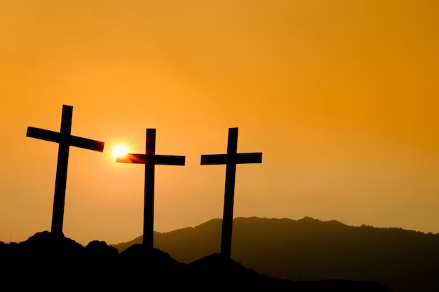 Crucifixion Of Jesus Christ At Sunrise - Silhouette Three Crosses On Hill