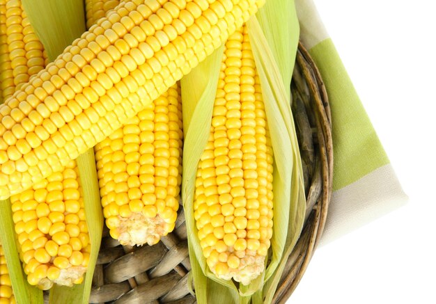 Crude corns on wicker tray isolated on white