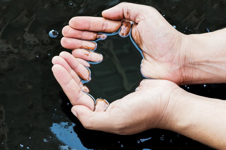crude oil in hand due to crude oil leak. oil ans gas process