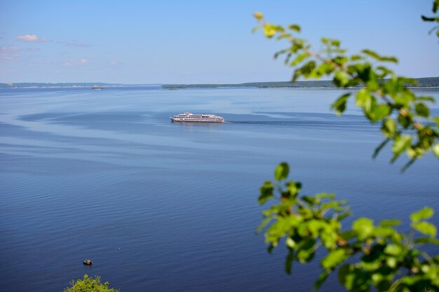 a cruise boat on the Volga river isolated view from top of the hill