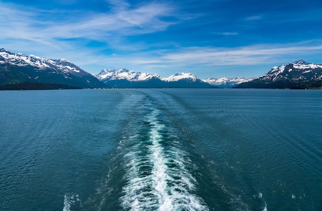 Cruise boat wake leaving town of Valdez in Alaska