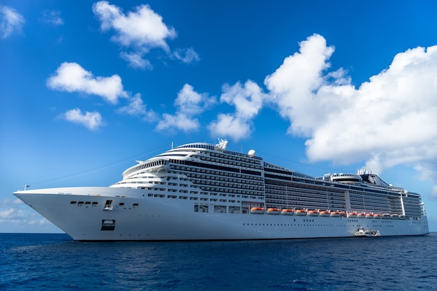 Cruise ship in crystal blue water with blue sky
