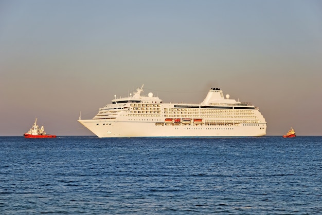 Cruise ship and two tugboats