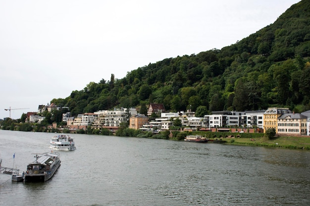 Cruises riding in Rhine and Neckar river bring passengers traveler visit and looking at riverside of Heidelberg old town on August 25 2017 in Heidelberg Germany