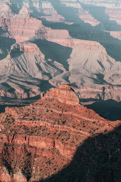 Crumbling red peak of grand canyon in sunlight