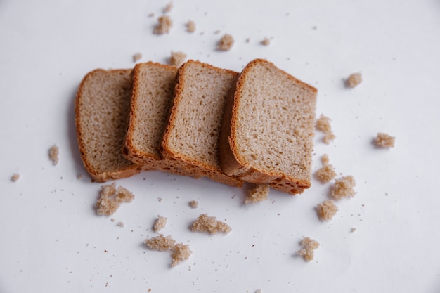 Crumbs en het brood snijden dicht omhoog. Bakkerij, voedselconcept