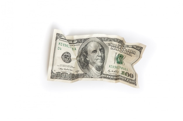A crumpled bill of one hundred dollars on a white background is insulated.