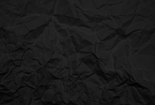 背景画像のしわくちゃの黒い紙