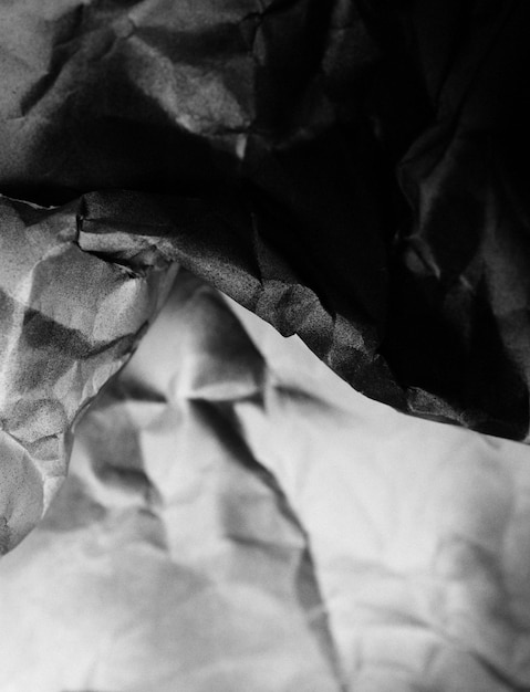 Crumpled black and white paper background