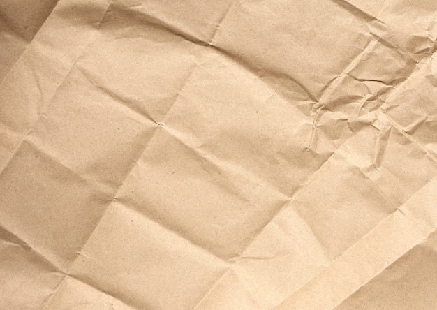 Crumpled blank sheet of brown wrapping kraft paper
