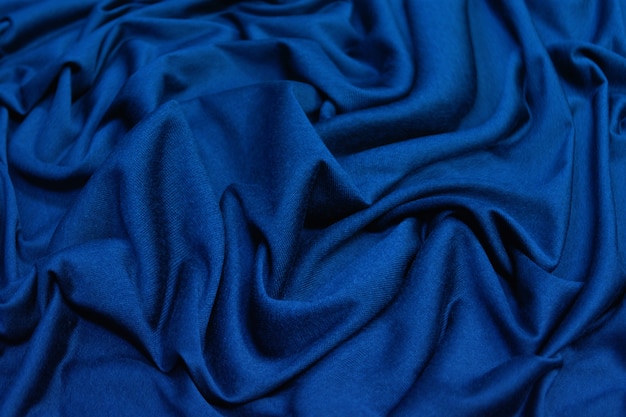 Photo crumpled blue fabric background