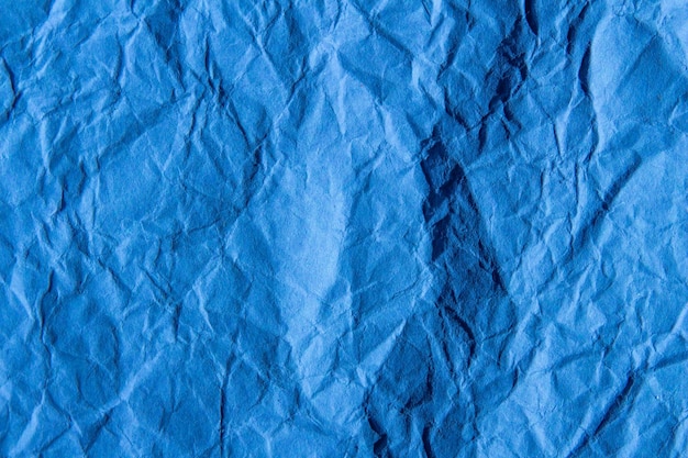 Crumpled blue paper texture background