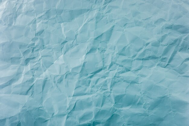 Crumpled Blue paper with soft texture. Simple background.