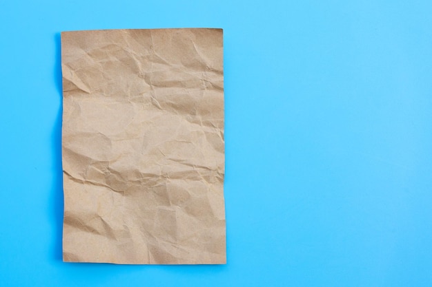 Crumpled brown on blue background