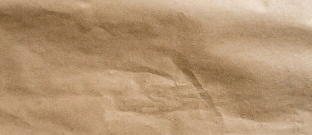 Photo crumpled brown paper background and texture with copy  space.