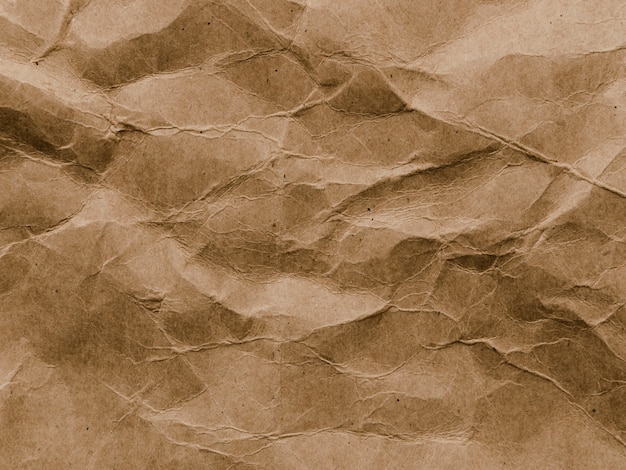 Фото Скомканный коричневый бумажный фон