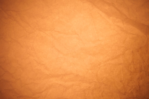 Crumpled brown paper background.