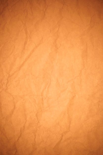 Crumpled brown paper background.