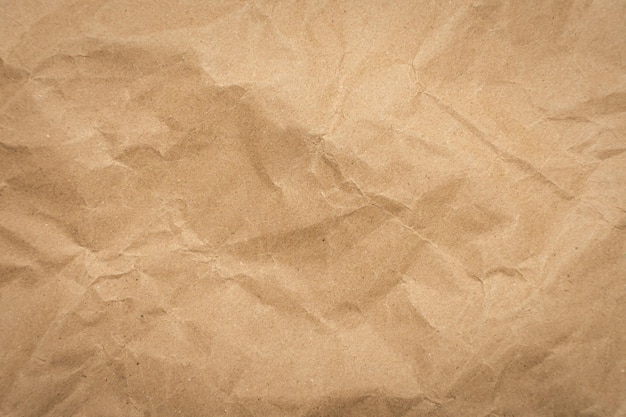 Crumpled brown paper texture vintage background.