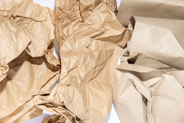 Crumpled brown paper on a white background Kraft paper for packaging