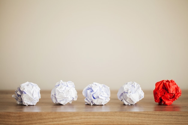 Photo crumpled colorful paper on wooden table, copy space