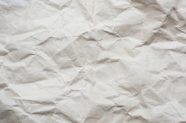 Crumpled cream color tone paper pattern texture background