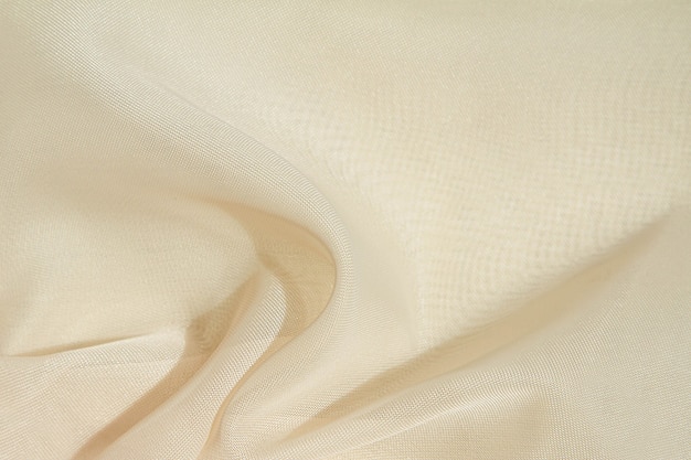 Crumpled fabric background,light airy, transparent fabric texture.