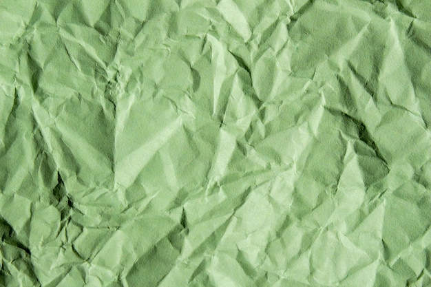 Crumpled green paper texture background