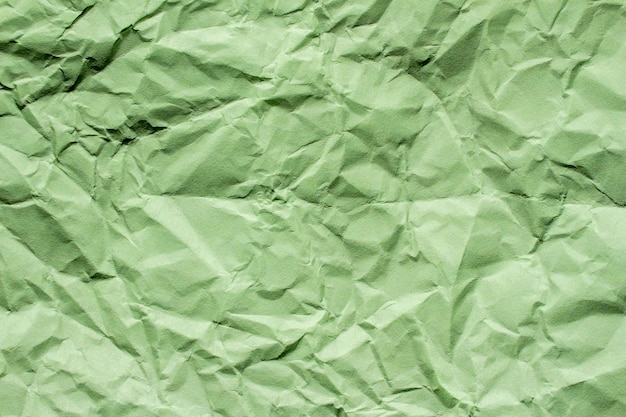 Crumpled green paper texture background