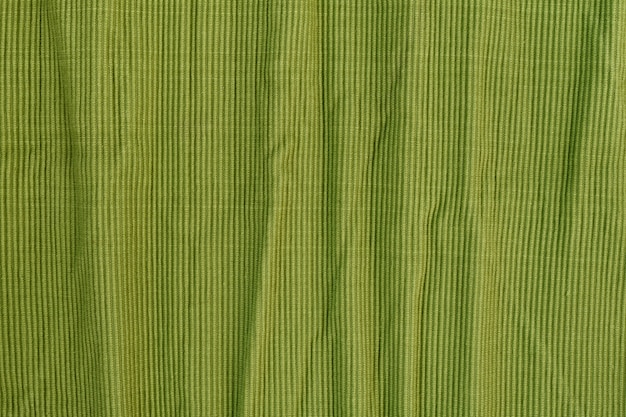 Crumpled green textured cotton fabric