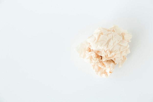 Crumpled grey paper ball on white background