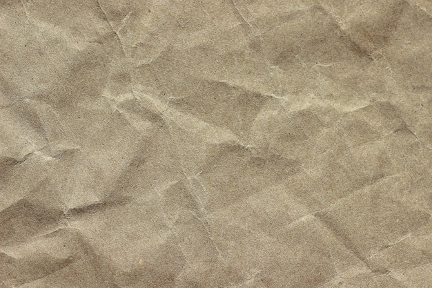 Crumpled kraft beige paper background