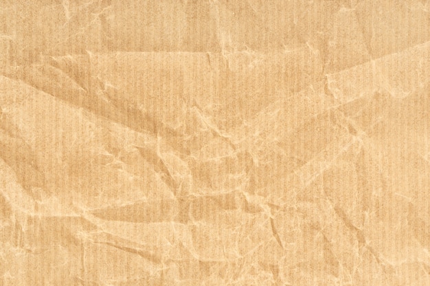Crumpled Kraft paper texture background. Light brown color
