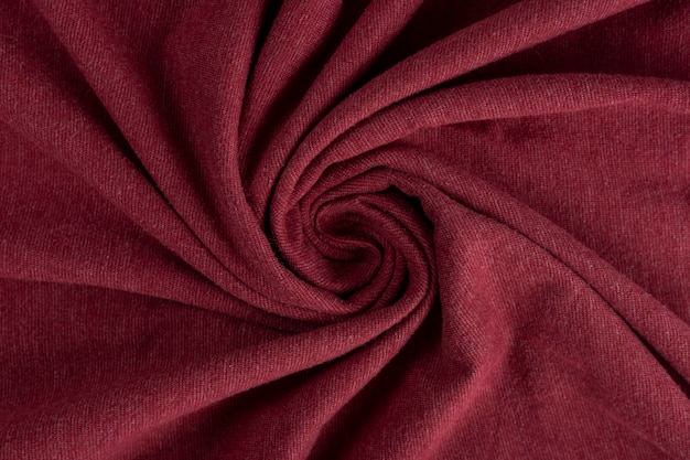 Crumpled linen cloth texture. Wrinkled textile. Red.