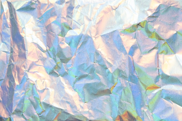 Photo crumpled neon holographic paper texture
