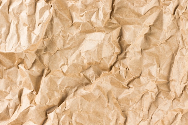 Photo crumpled old kraft paper texture.