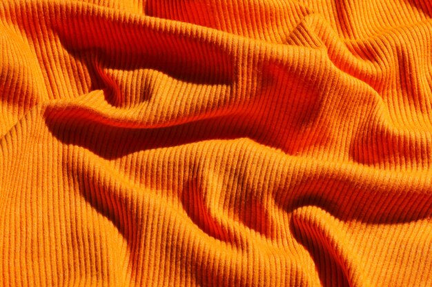 Crumpled orange fabric sweater