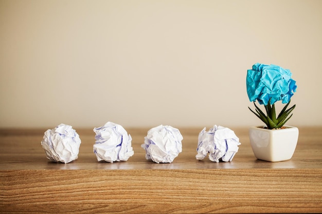 Crumpled paper balls on wood background